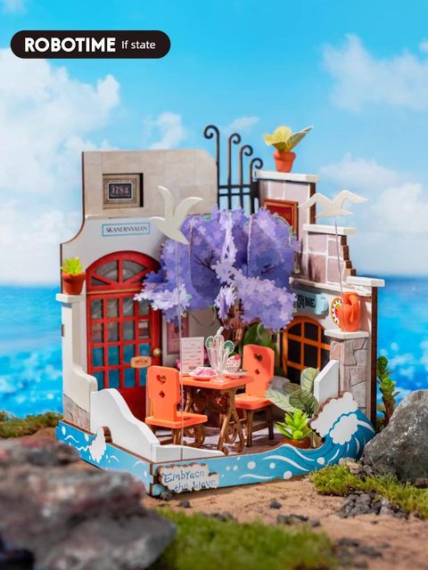 The seaside restaurant is miniaturely reduced in size and a small house. Diy wooden cottage. Handmade gifts. Artistic woman