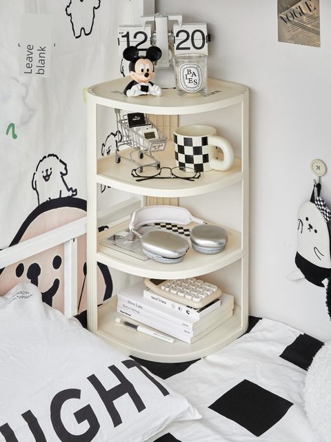 The dormitory bed rack corner bedside storage cabinet is fully included in the bed curtain storage box. The object artifact is laid on the bed
